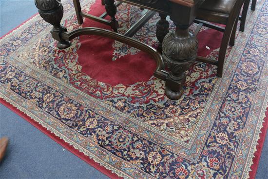 A Persian claret ground carpet, 290 x 225cm